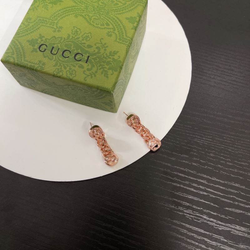G*u*i earrings